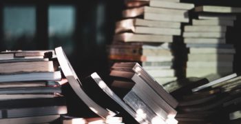 stack-old-books-wooden-table-learning-education-concepts-selective-focus_42691-111