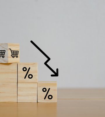 financial-crisis-concept-wooden-block-signs-symbols-shopping-cart-white-background-with-percentage-sign-store-loss-income-capital-lost-cost-reduction-declining-chart-down-profit