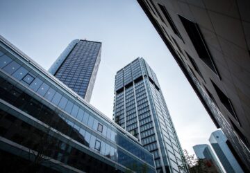 A low angle shot of high rise buildings under the clear sky in Frankfurt, Germany