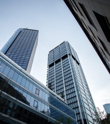A low angle shot of high rise buildings under the clear sky in Frankfurt, Germany